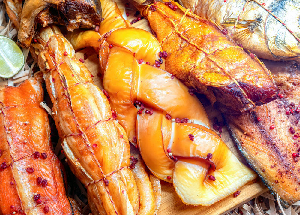 Close-up of smoked fish fillets with a glossy finish.
