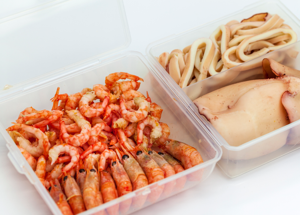 Seafood and noodles in plastic containers ready to eat.
